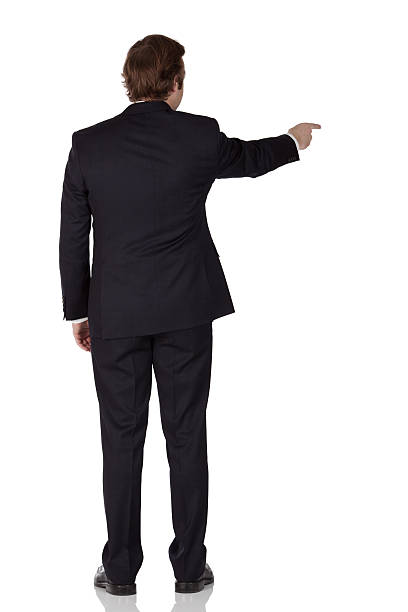 istock Rear view of a businessman pointing with finger 186826215