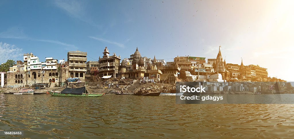 Manikarnika Ghat in Varanasi Manikarnika Ghat (also known as the burning ghat) is major cremation place where up to 250 dead bodies are burned a day. In Hinduism it is believed that those who die and are cremated in this holy city get an instant gateway to liberation from the cycle of births and re-births. Abstract Stock Photo