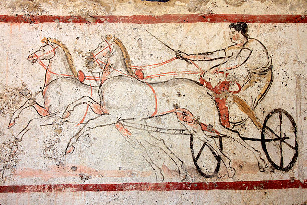 Chariot Race (480-470 B.C.) Detail of a painting depicting a chariot with two horses, found in a sarcophagus near Paestum, major Graeco-Roman city in the Campania region of Italy. Other images in: ancient roman civilization stock pictures, royalty-free photos & images