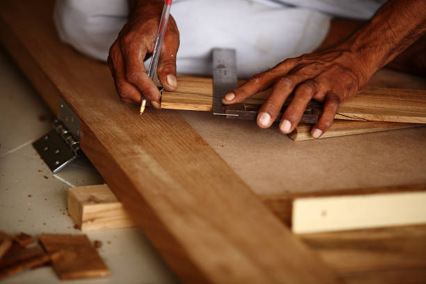 istock Carpenter making Modern Teak wood Pasted Door marking with Scale 186826629