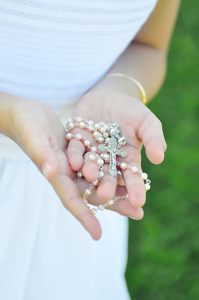 istock Rosary in Girl's hands 186826720