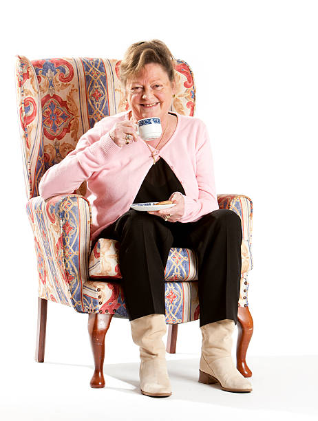 istock seniors: retired woman enjoying a tea break 186826760