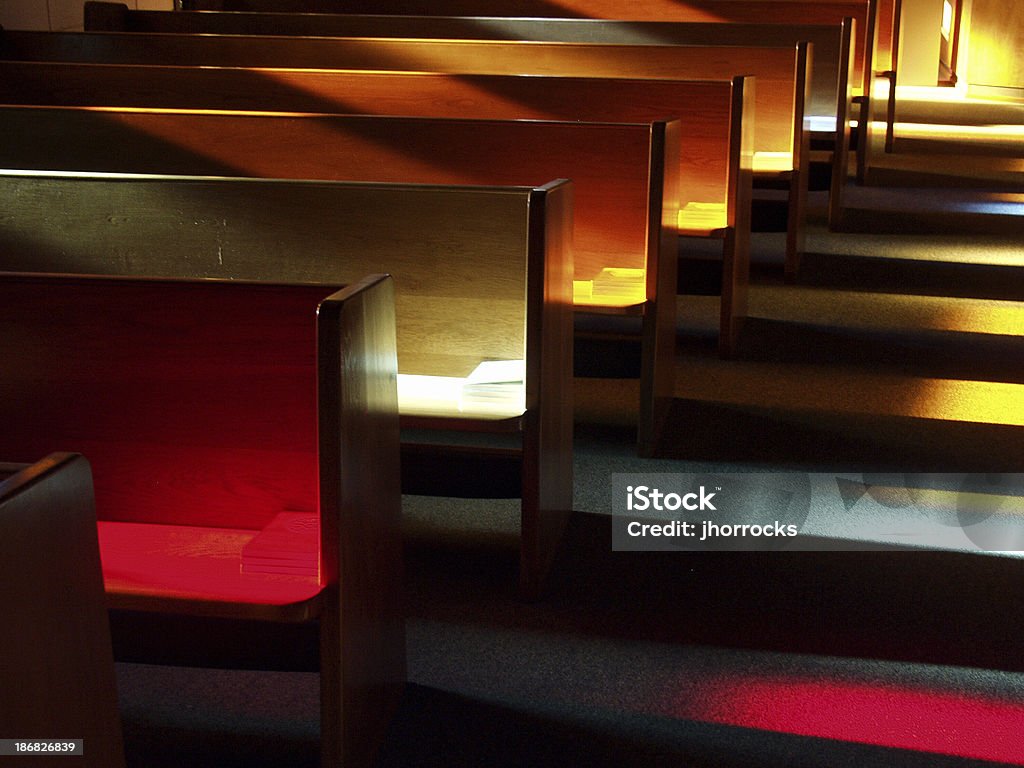 Church Benches at Sunset Shot these benches (or pews) at sunset after a friend's wedding rehearsal with an Olympus E-10 digital SLR. Church Stock Photo