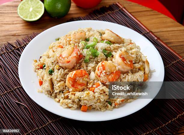 Plate Of Shrimp Fried Rice On A Placemat And Wood Table Stock Photo - Download Image Now