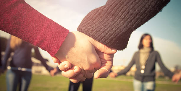 istock Holding hands, multiracial couple in love 186827265