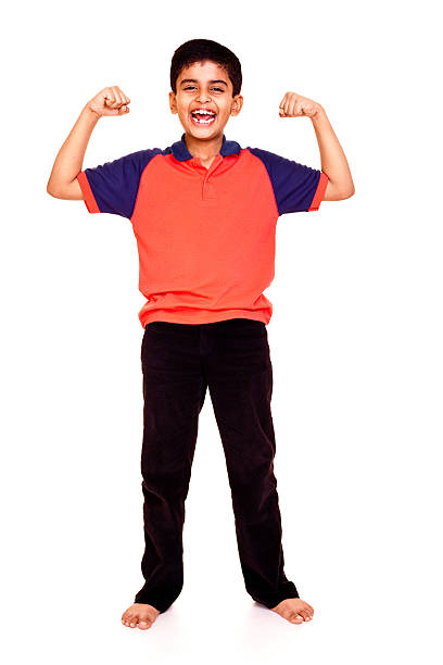 istock Isolated Indian Boy Standing Smiling Showing Muscle Full Length 186827399