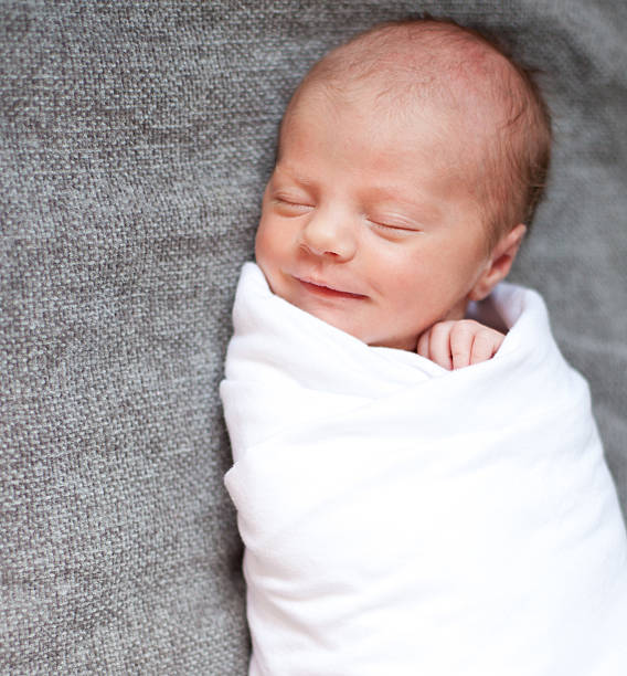 Swaddled Baby with a Smile stock photo