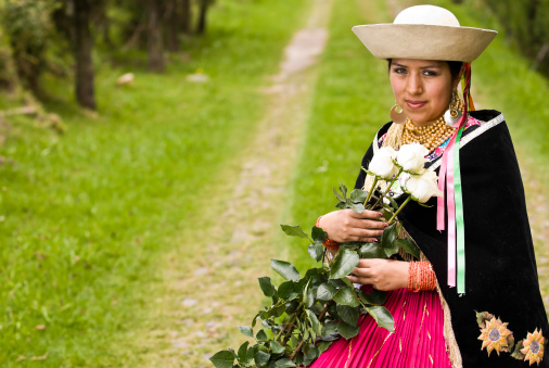 Ecuadorian girl with a bunch of white roses.
