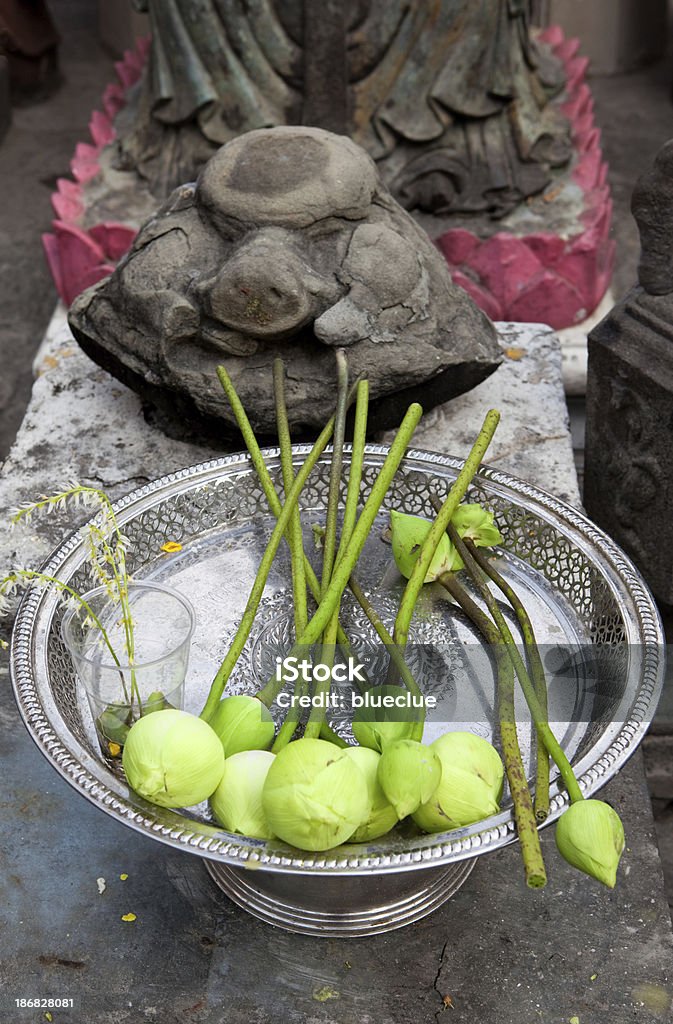 Lotus offerings in Buddhist temple "Lotus and flower offerings in Buddhist temple, Bangkok, Thailand" Bangkok Stock Photo