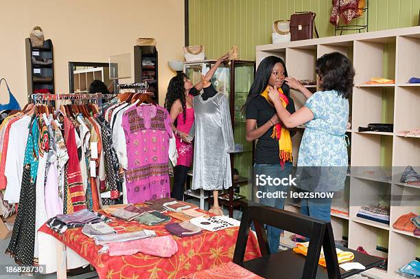Salesperson Assisting Clothes Shopper Stock Photo - Download Image Now - Adult, Adults Only, African Ethnicity