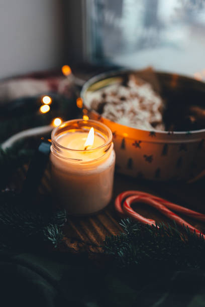 istock Burning soy wax candle in a Christmas atmosphere, mood 1868294901