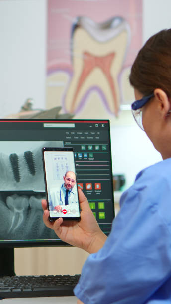 istock Nurse having video call with expert stomatologic medic 1868301674