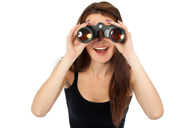 istock Woman with binoculars - searching 186830330