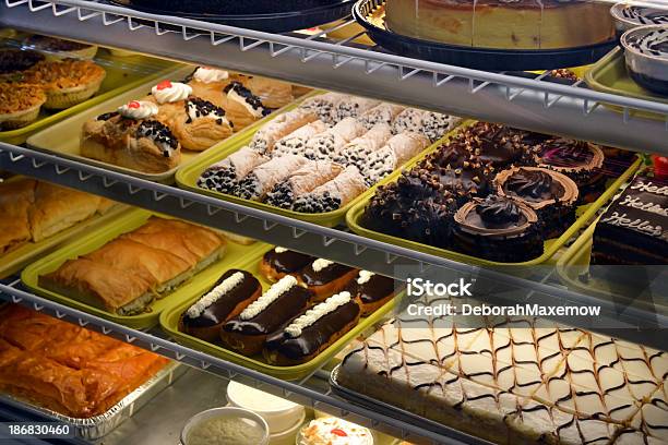 Bakery Case Shelf Lighting Filled With Pastries And Treats Stock Photo - Download Image Now