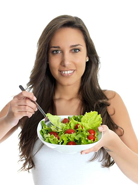 istock girl eating salad 186830464