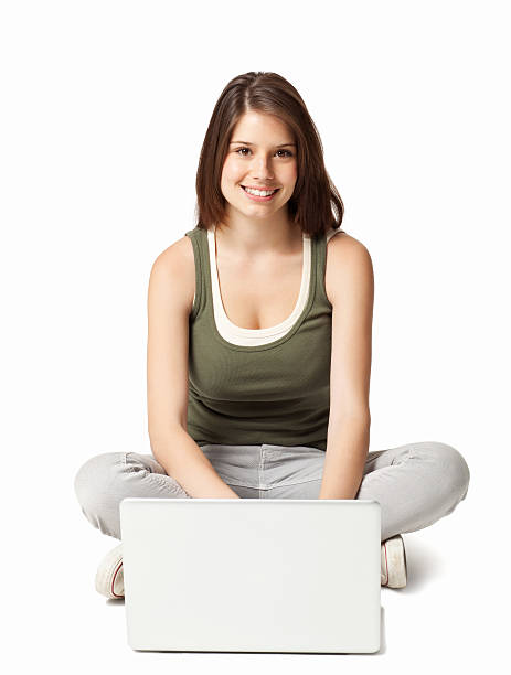 istock Teenage Girl at a Laptop - Isolated 186830863