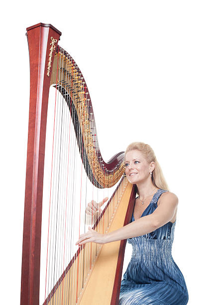 istock Smiling woman playing harp 186831153