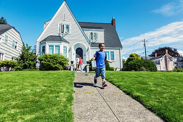 istock Young Boy Running Off To School 186831312