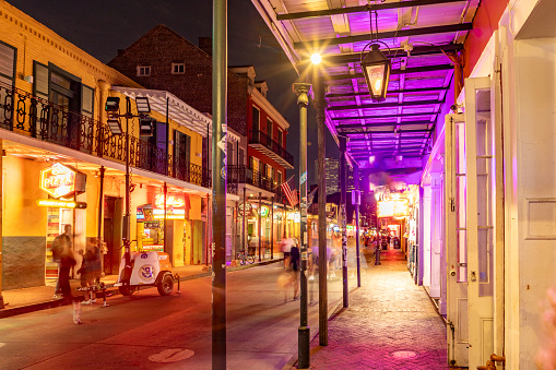 New Orleans, USA - October 24, 2023: Pubs and bars with neon lights in the French Quarter, downtown New Orleans.