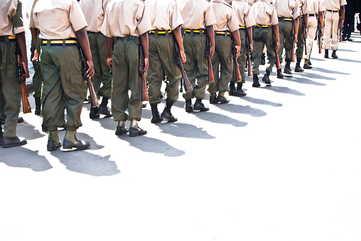 troops or soldiers marching in line