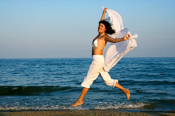 istock Happy girl at the beach 186831873