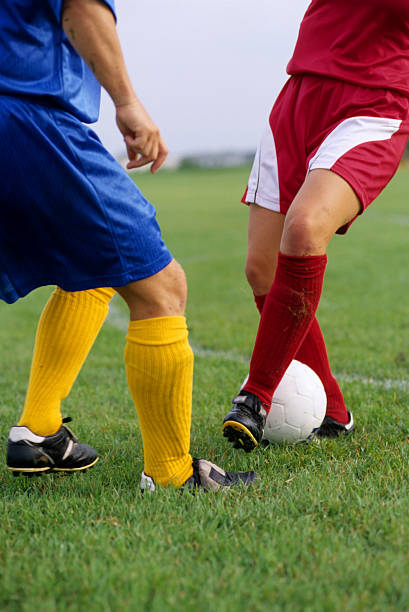 istock soccer players battle it out 186831988