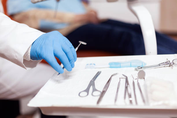 istock Close up stomatolog taking ustensils for dental intervention 1868320402