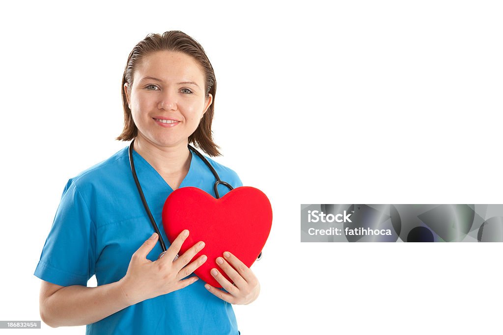 Young Women Healthcare Worker and Heart Shape Portrait of a young female doctor holding a heart shape.(XXXL) 30-39 Years Stock Photo