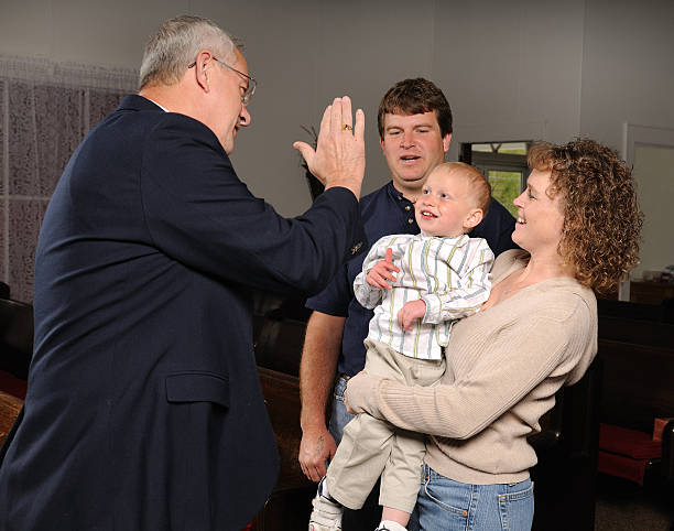 istock Pastor Greeting Family 186833173