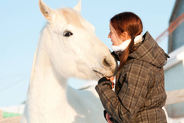 istock Woman and White Horse 186833244