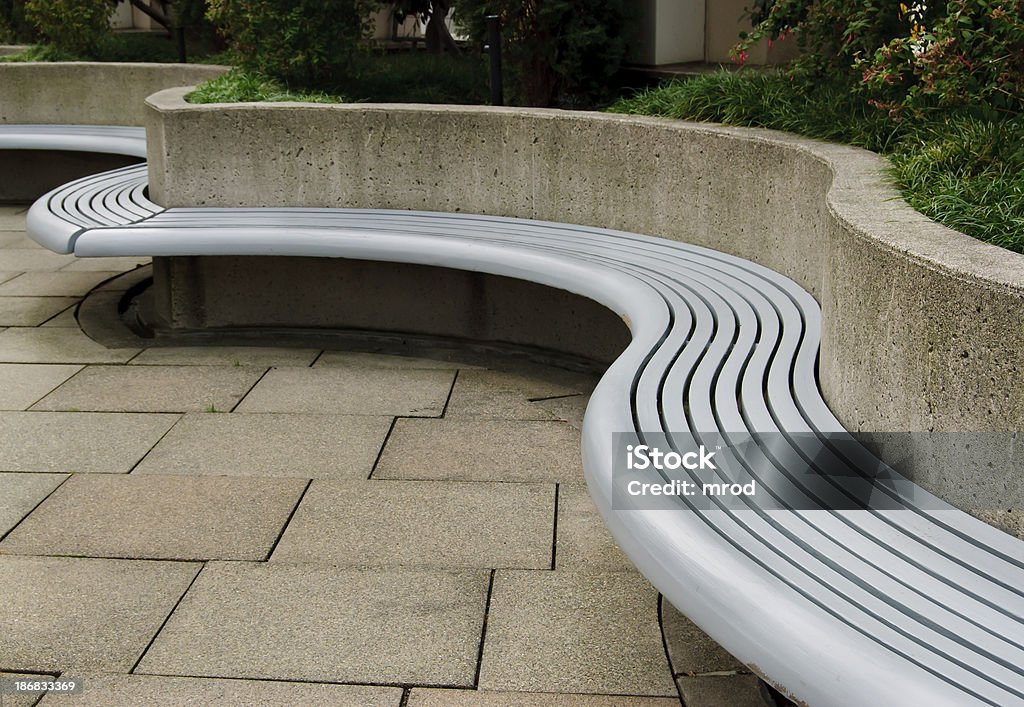 Curved Bench "A curved bench located in Freeway Park, outside the Seattle Convention Center in Seattle, Washington." Architecture Stock Photo