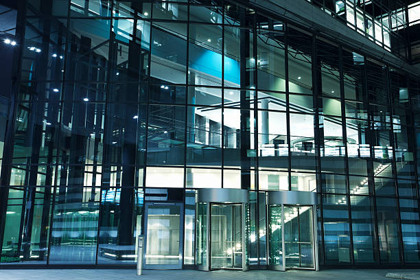 istock Modern Office Building Entrance with Revolving Doors at Night 186834111