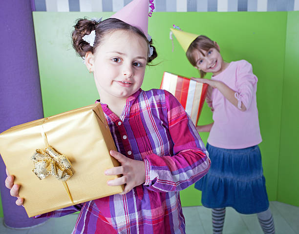 istock Two girls with birthday presents. 186834261