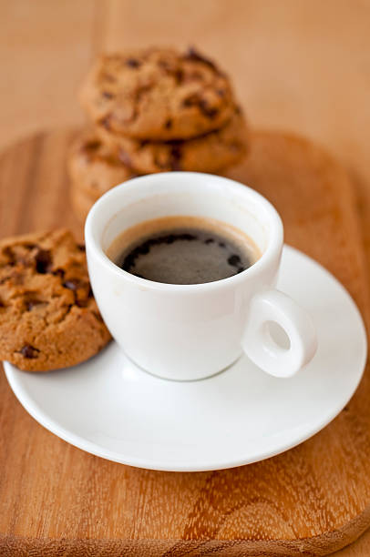 istock Cup of Espresso and cookies on a cutting board 186834285