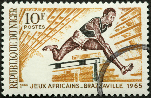 African hurdler on an old stamp