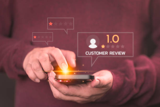 istock Customer review and feedback with rate 1 star on virtual screen. Assessment testimonial review for dislike service and low quality. Business concept of customer experience dissatisfied by smartphone. 1868344403
