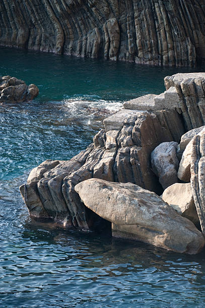 istock rocks close to the beach 186834682