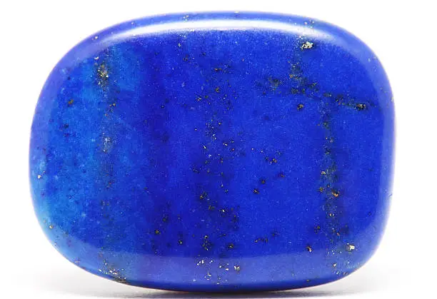 Single lapis lazuli gem stone on white background