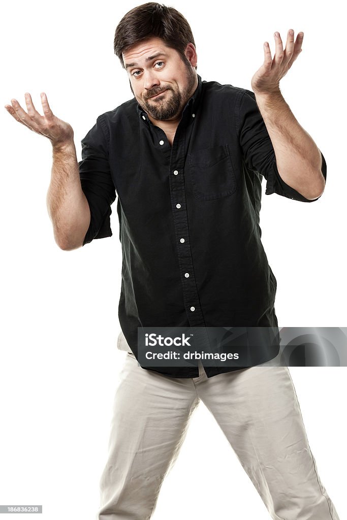 Shrugging Man, Three Quarter Length Portrait of a man on a white background. 30-39 Years Stock Photo