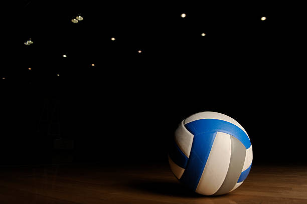 istock Volleyball in an empty gym 186836463