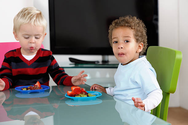 istock Toddlers Having Fruit In The Living Room 186836704