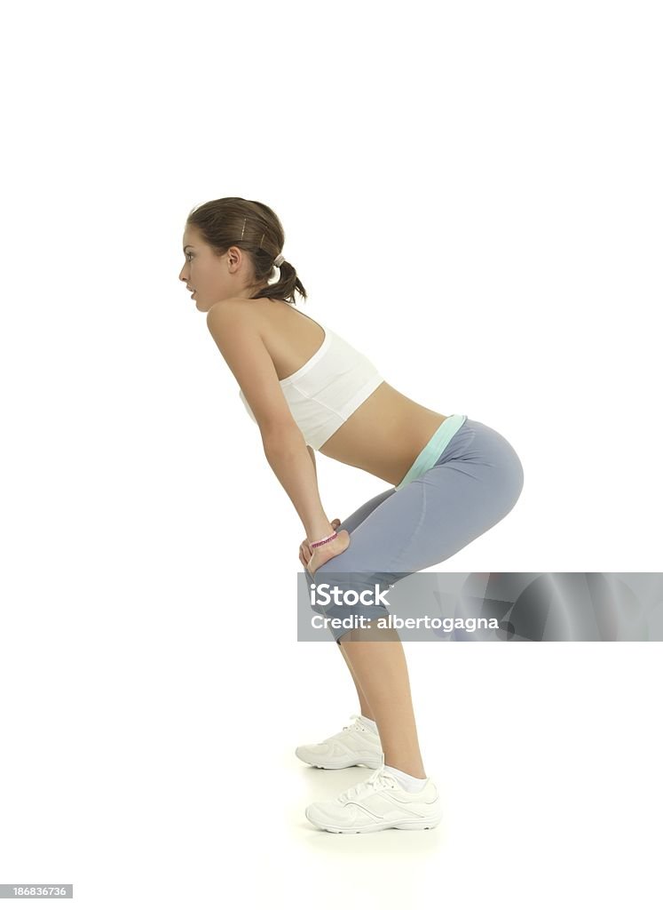 Ragazza di stretching - Foto stock royalty-free di Abbigliamento sportivo