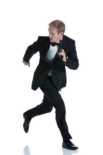 istock Man running with a handgun 186836750