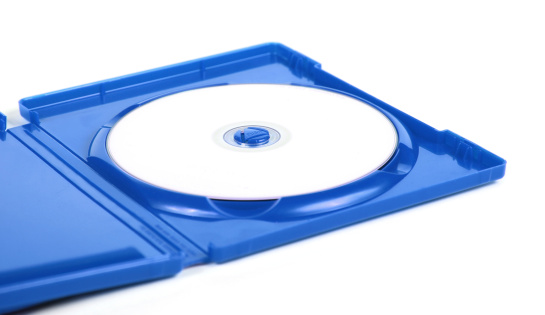 Blank disk with copyspace in blue case. Blu-ray disk in jewel case.