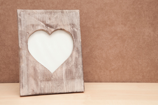 An empty heart shape wooden photo frame. Wallpaper background. Horizontal composition. Shot in response to brief Jan11BlankSlate