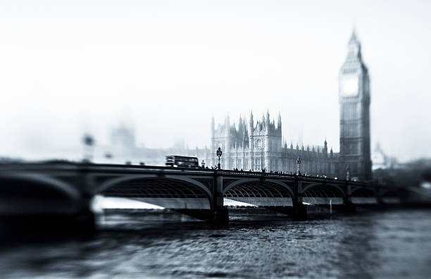 Big Ben And Houses Of Parliament In The Fog "Big Ben and Houses Of Parliament in the fog at dawn, black and white, London. Tilt & Shift lens. Fine grain added.View my lightbox:" tilt shift stock pictures, royalty-free photos & images
