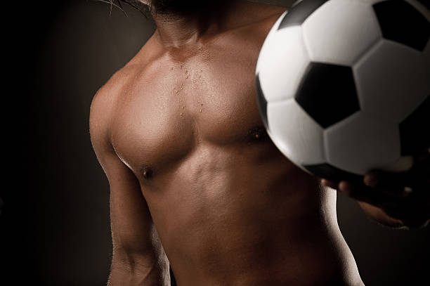 istock Strong man with soccer ball 186837433