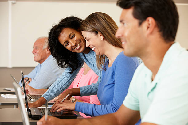 istock Teacher and mature students in class 186837581