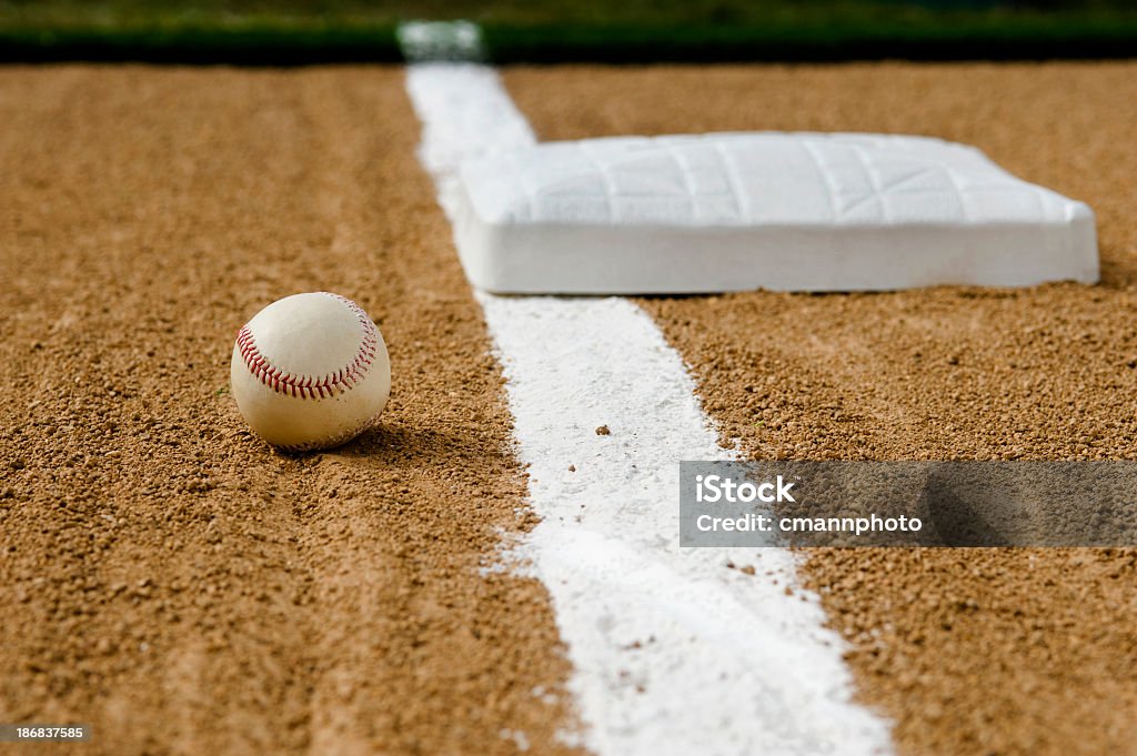 Baseball - Foul Ball A foul ball up the third base line, with an imprint in the chalk line where the ball rolled over the foul line. Baseball - Ball Stock Photo