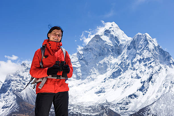 istock Woman is looking through binoculars in Mount Everest National Park 186837712